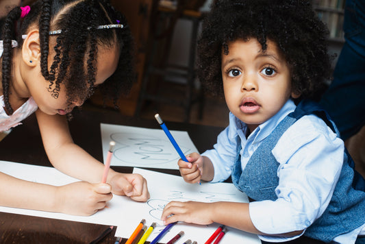 Happy-kids-coloring-at-a-table